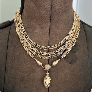 dress up multiple necklace gold tone fold over close with a gold tear drop